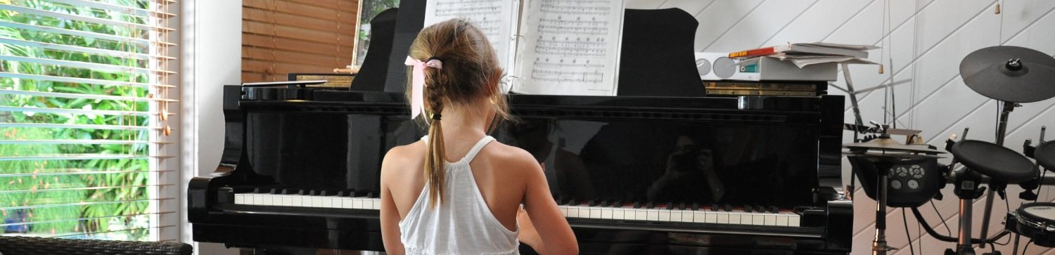 A student at a grand piano