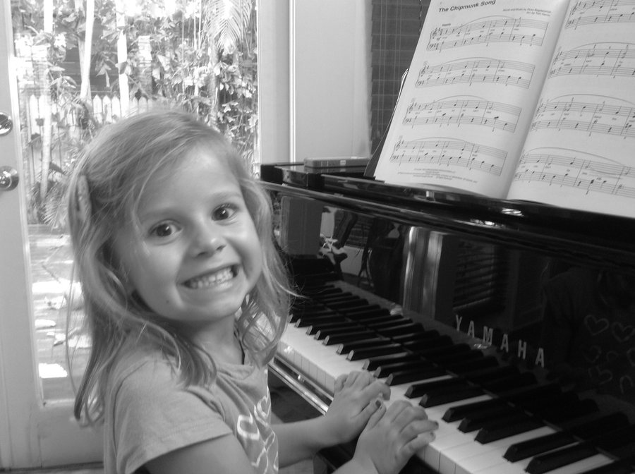 girl playing piano